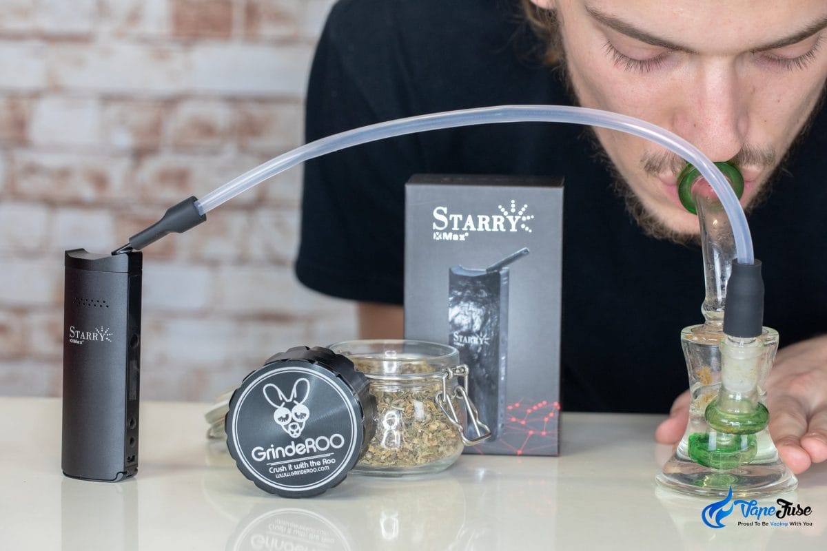 Xmax Starry vaporizer connected to water pipe