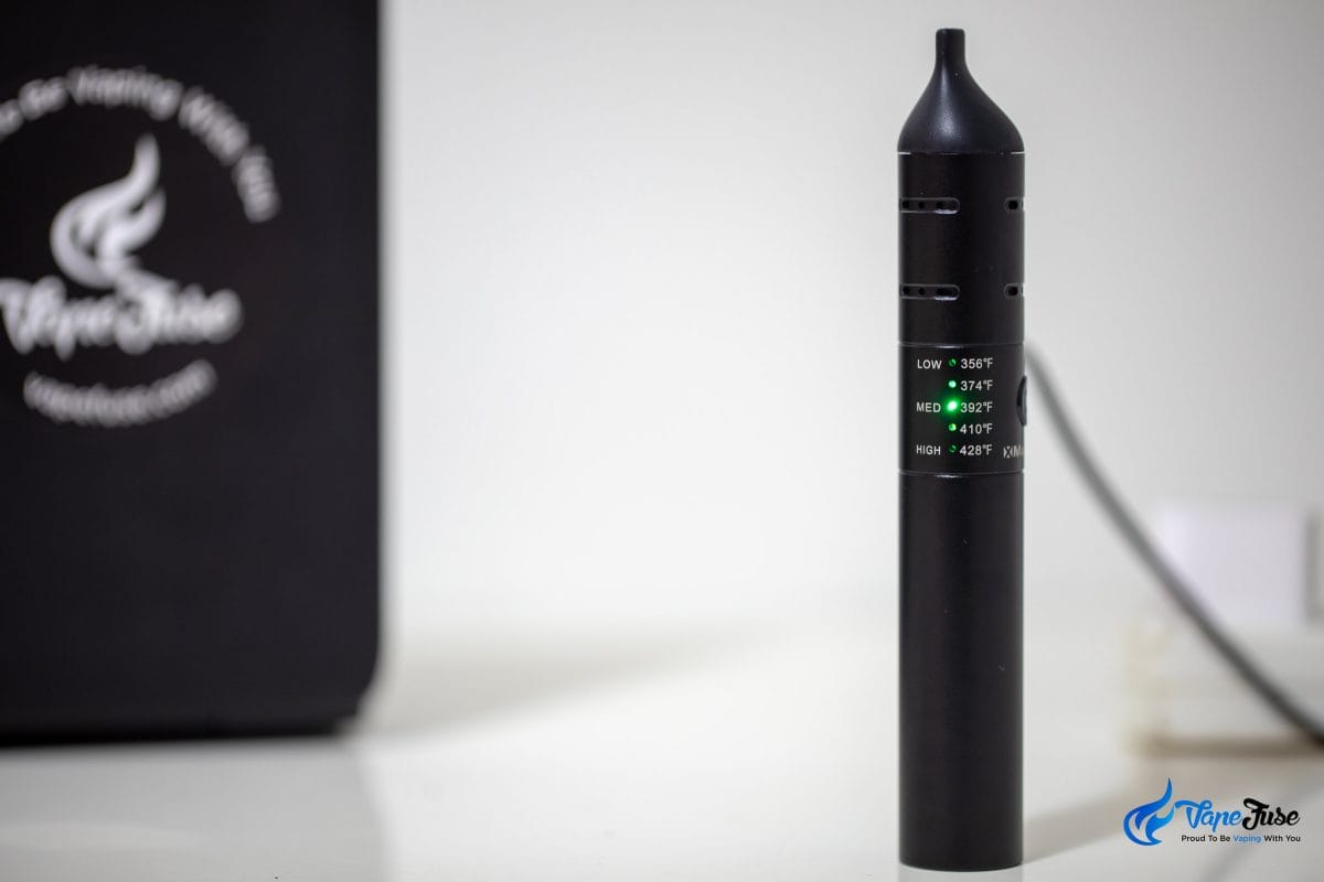 Xmax V2 Pro vaporizer on the charger