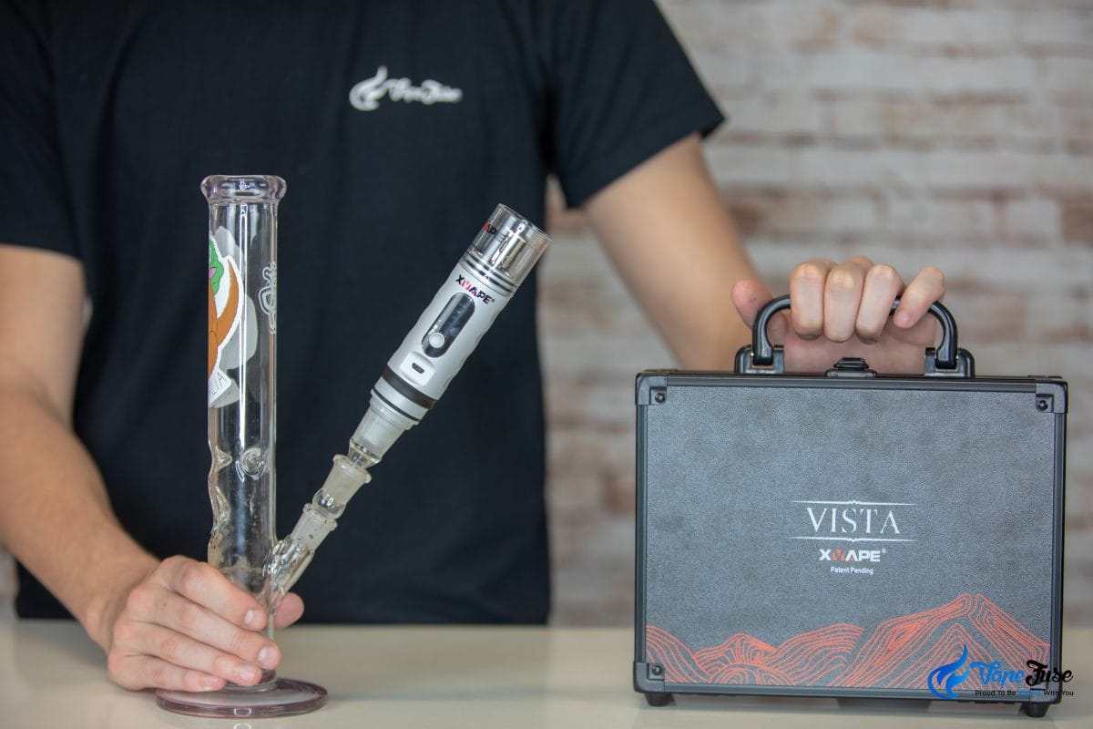Xmax Vista Concentrate Vape connected to bong